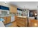 Bright kitchen featuring natural wood cabinetry and a central island at 402 Green Turret Dr, Rolesville, NC 27571