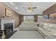 Comfortable living room with a fireplace, plush seating, and crown molding at 402 Green Turret Dr, Rolesville, NC 27571