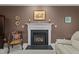 Cozy living room with fireplace and decorative mantel at 402 Green Turret Dr, Rolesville, NC 27571