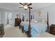 Main bedroom with four-poster bed, walk-in closet, and adjoining bathroom at 402 Green Turret Dr, Rolesville, NC 27571