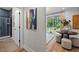 Stylish entryway leading to a bathroom, featuring a modern shower with blue tiling and contemporary design at 4504 Mint Leaf Ln, Raleigh, NC 27612