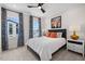 Inviting bedroom with large windows, stylish curtains, and comfortable furnishings at 4504 Mint Leaf Ln, Raleigh, NC 27612