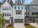 Attractive modern townhomes with gray garages, well-maintained lawns, and a contemporary design at 4504 Mint Leaf Ln, Raleigh, NC 27612