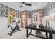 Well-equipped home gym/office featuring exercise bike, desk, and striking wallpaper at 4504 Mint Leaf Ln, Raleigh, NC 27612