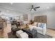 Open-concept living room with fireplace, comfortable seating, and views into the kitchen and dining areas at 4504 Mint Leaf Ln, Raleigh, NC 27612