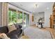 Relaxing living room featuring modern decor, a comfortable sofa, and sliding glass doors to the backyard at 4504 Mint Leaf Ln, Raleigh, NC 27612