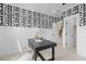 Stylish home office space with modern desk, chair, and statement wallpaper at 4504 Mint Leaf Ln, Raleigh, NC 27612