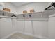 Spacious walk-in closet with ample shelving and hanging space for optimal organization at 4504 Mint Leaf Ln, Raleigh, NC 27612