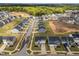Aerial view of a community with well-maintained lawns and sidewalks on a sunny day at 4524 Flat Bastion Drive Dr, Raleigh, NC 27610