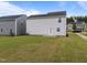 Spacious backyard featuring a well-maintained lawn and a cozy patio, perfect for outdoor enjoyment at 4524 Flat Bastion Drive Dr, Raleigh, NC 27610