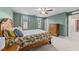 Relaxing bedroom with a wooden bed frame, soft carpet, and matching wooden dresser for ample storage at 4524 Flat Bastion Drive Dr, Raleigh, NC 27610