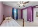 Charming bedroom with ceiling fan, carpet, and purple walls that create a cozy atmosphere at 4524 Flat Bastion Drive Dr, Raleigh, NC 27610