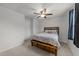 Comfortable bedroom featuring neutral colors, ceiling fan, and stylish furniture for a peaceful retreat at 4524 Flat Bastion Drive Dr, Raleigh, NC 27610