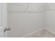 Walk-in closet provides ample storage with wire shelving and neutral carpeting at 4524 Flat Bastion Drive Dr, Raleigh, NC 27610