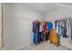 Spacious walk-in closet with built-in shelving and hanging rods for easy organization of clothing at 4524 Flat Bastion Drive Dr, Raleigh, NC 27610