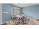 Dining area showcasing a modern table with stylish chairs, accented by natural light and elegant decor at 4524 Flat Bastion Drive Dr, Raleigh, NC 27610