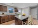 Charming kitchen features granite countertops, stainless steel appliances, and a kitchen island with seating at 4524 Flat Bastion Drive Dr, Raleigh, NC 27610