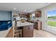 Open-concept kitchen with granite counters, stainless appliances, and an island with seating at 4524 Flat Bastion Drive Dr, Raleigh, NC 27610