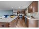The kitchen boasts stainless steel appliances, granite countertops, and a spacious island with seating and storage at 4524 Flat Bastion Drive Dr, Raleigh, NC 27610