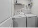Laundry room showcasing updated appliances and ample shelf space for storage solutions at 4524 Flat Bastion Drive Dr, Raleigh, NC 27610