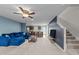 Open-concept living room shows a modern design, blending seamlessly into the kitchen and staircase at 4524 Flat Bastion Drive Dr, Raleigh, NC 27610
