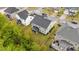 Aerial view of a home with a landscaped yard and screened porch, showcasing the property's setting and backyard at 4803 Stony Falls Way, Knightdale, NC 27545