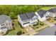 Beautiful home with a front porch, well-manicured lawn, and ample parking, enhanced by mature trees and landscaping at 4803 Stony Falls Way, Knightdale, NC 27545