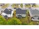 Aerial view of a home highlighting its manicured lawn, screened-in porch, and overall neighborhood setting at 4803 Stony Falls Way, Knightdale, NC 27545