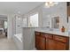 Bathroom featuring a glass-enclosed shower, a large soaking tub, and a vanity at 4803 Stony Falls Way, Knightdale, NC 27545