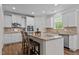 Modern kitchen with granite countertops, stainless steel appliances, and breakfast bar at 4803 Stony Falls Way, Knightdale, NC 27545