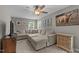 Spacious living room with a large sectional couch and unique decor at 4803 Stony Falls Way, Knightdale, NC 27545