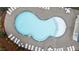 Overhead shot of the community pool with many lounge chairs around the perimeter at 4803 Stony Falls Way, Knightdale, NC 27545