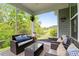 Inviting screened porch with comfortable seating and scenic backyard views for relaxation and outdoor enjoyment at 4803 Stony Falls Way, Knightdale, NC 27545