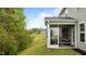 Comfortable screened porch with a view of the backyard, perfect for relaxation and enjoying the outdoors at 4803 Stony Falls Way, Knightdale, NC 27545
