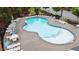 Aerial view of a sparkling pool surrounded by lounge chairs, perfect for relaxation and recreation in a community setting at 4803 Stony Falls Way, Knightdale, NC 27545
