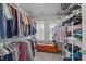 Organized walk-in closet featuring extensive shelving and hanging space for clothing and accessories at 4803 Stony Falls Way, Knightdale, NC 27545