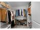 Spacious walk-in closet with ample shelving and storage for clothes and shoes at 4803 Stony Falls Way, Knightdale, NC 27545