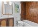 Updated bathroom features a vanity, bronze tile and bright window at 4812 Latimer Rd, Raleigh, NC 27609