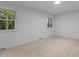 Bright and airy bedroom featuring neutral walls, wood floors and large windows at 4812 Latimer Rd, Raleigh, NC 27609