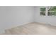 Minimalist bedroom with hardwood flooring and window at 4812 Latimer Rd, Raleigh, NC 27609