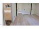 Spacious bedroom with light wood floors, walk in closet and multiple doors at 4812 Latimer Rd, Raleigh, NC 27609