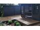 Outdoor deck with view of screened porch, shed and wooded backyard at 4812 Latimer Rd, Raleigh, NC 27609