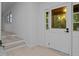 Bright foyer with light wood floors and glass paned exterior door at 4812 Latimer Rd, Raleigh, NC 27609