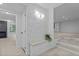 Bright entryway with stone accent wall, bench, and light wood floors at 4812 Latimer Rd, Raleigh, NC 27609