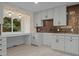 Bright kitchen featuring large windows, modern cabinetry, and new countertops at 4812 Latimer Rd, Raleigh, NC 27609