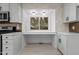Bright kitchen nook with storage and natural light at 4812 Latimer Rd, Raleigh, NC 27609