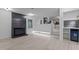 Bright living room with fireplace, built-in beverage fridge and light wood floors at 4812 Latimer Rd, Raleigh, NC 27609