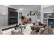 Cozy living room showcases a fireplace, comfortable seating, and open view into the updated kitchen at 4812 Latimer Rd, Raleigh, NC 27609