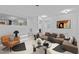 Inviting living room with stairs, comfortable seating, and open view into the entry at 4812 Latimer Rd, Raleigh, NC 27609