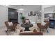 Cozy living room features a fireplace, comfortable seating, and views into the updated kitchen at 4812 Latimer Rd, Raleigh, NC 27609